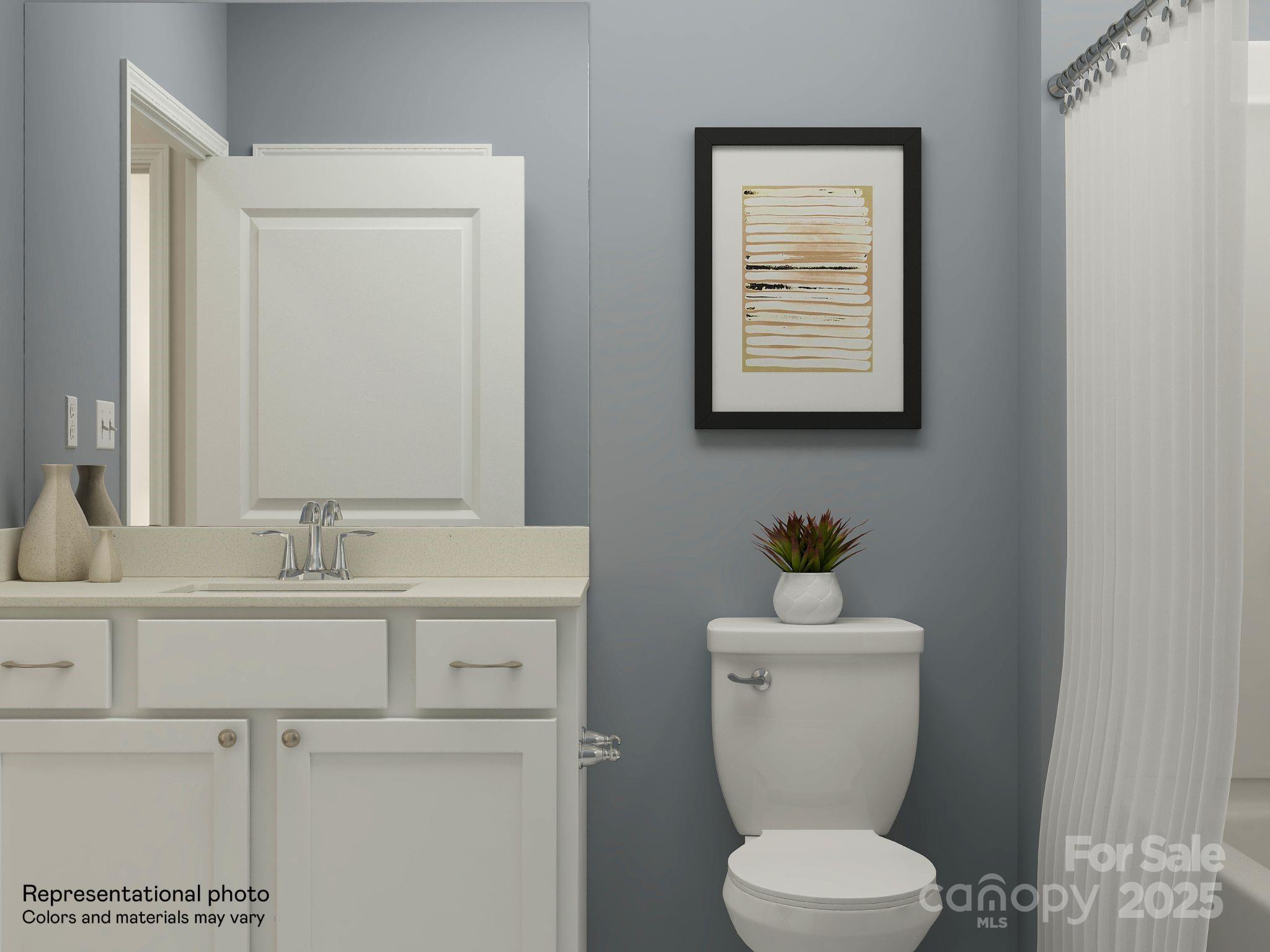 4122 Camden Gln Road Lancaster, SC 29720 - Photo 12 of 26 a bathroom with a toilet a sink and mirror