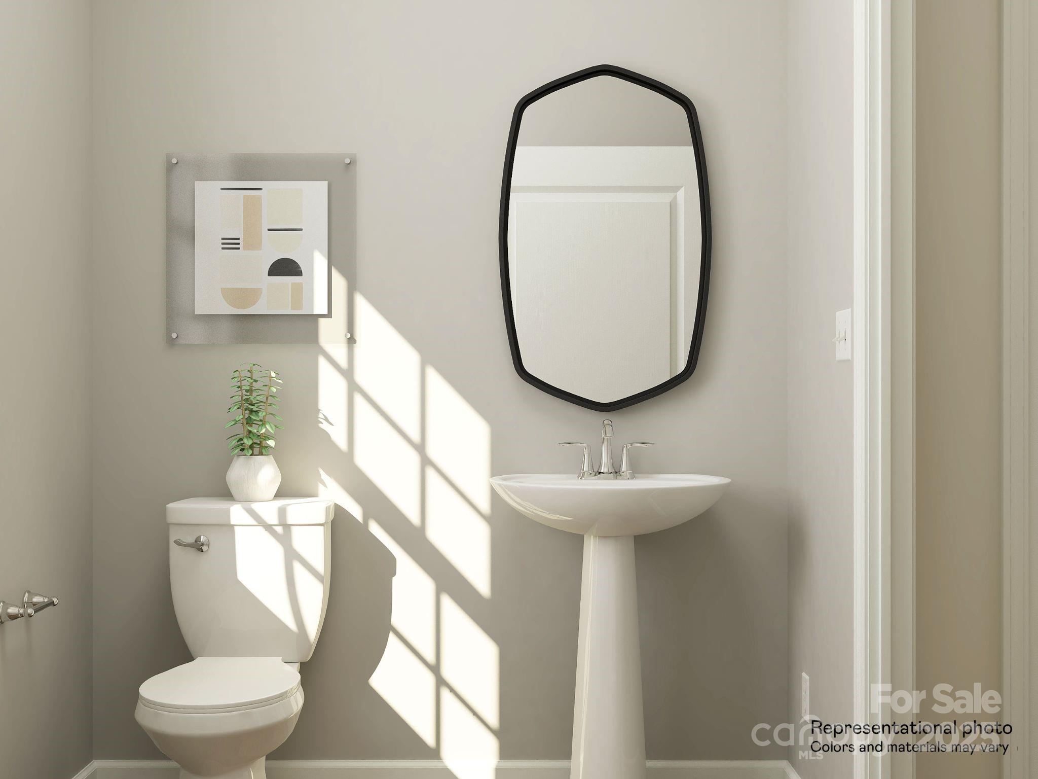 4122 Camden Gln Road Lancaster, SC 29720 - Photo 9 of 26 a bathroom with a toilet sink and mirror