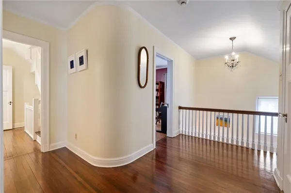 a view of hallway with wooden floor