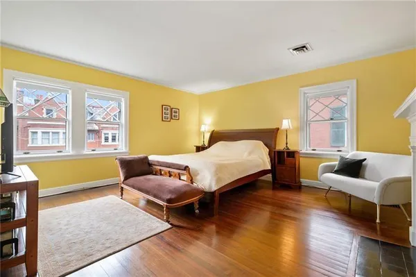 a bedroom with a bed and a couch