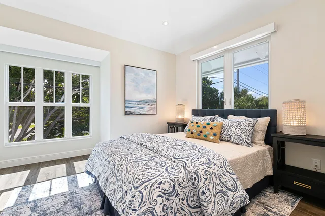 a bedroom with a large bed and a window