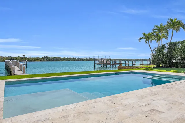 a view of a swimming pool and an outdoor seating