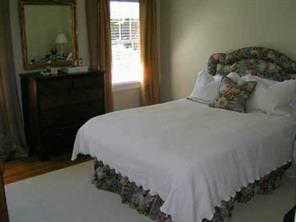 1529 Andover Road Charlotte, NC 28211 - Photo 5 of 8 a bed sitting in a bedroom next to a window