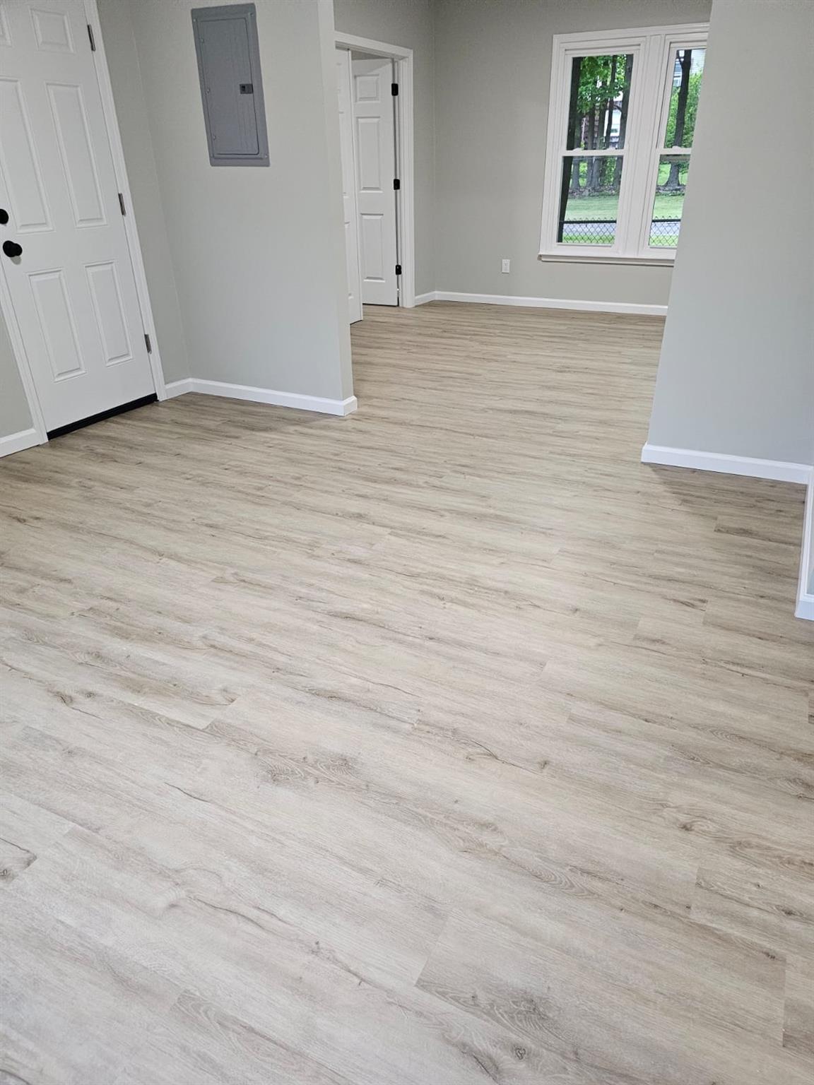 108 Pine Street, Unit #1 Wurtsboro, NY 12790 - Photo 5 of 18 a view of empty room with wooden floor