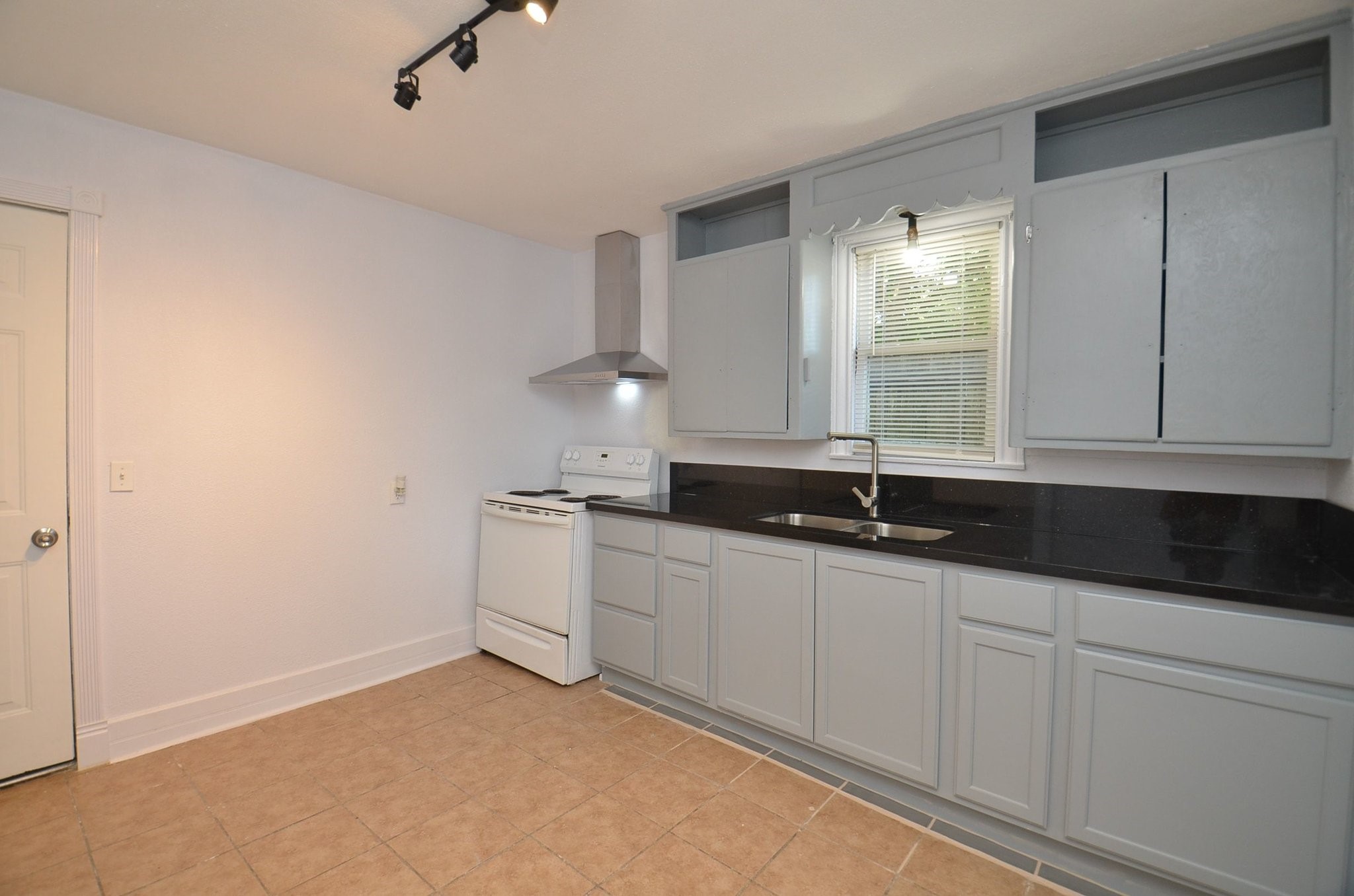 1600 5th Street Rosenberg, TX 77471 - Photo 10 of 24 Bright kitchen featuring spacious countertops.