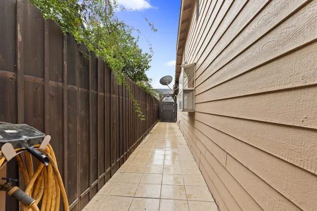 a view of a balcony with wooden floor