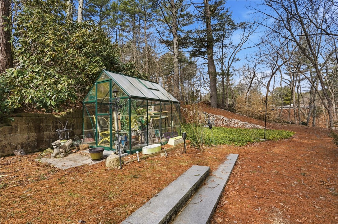 186 Arcadia Road Hopkinton, RI 02832 - Photo 26 of 27 Spanning a generous 1.6 acres, this property offers an beautiful opportunity for cultivating both a thriving garden and exceptional outdoor living experience. Imagine leisurely strolls along the river, framed by meticulously designed walkways, complemented by vibrant flowers, bushes and trees.