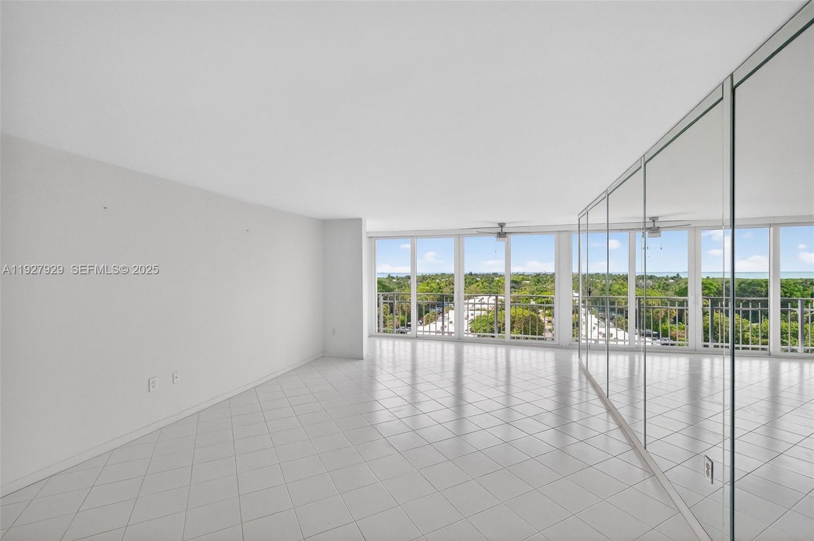 600 Grapetree Drive, Unit 8FS Key Biscayne, FL 33149 - Photo 18 of 54 a view of an empty room with a sliding door