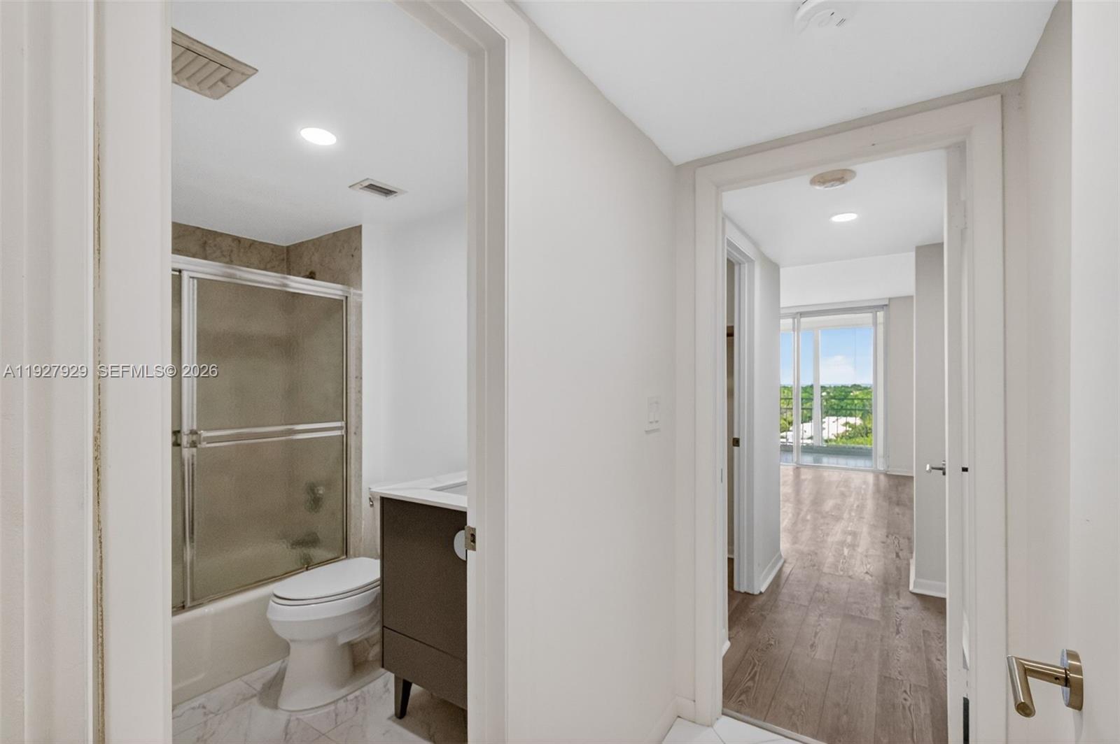 600 Grapetree Drive, Unit 8FS Key Biscayne, FL 33149 - Photo 19 of 54 a bathroom with a toilet shower and a sink