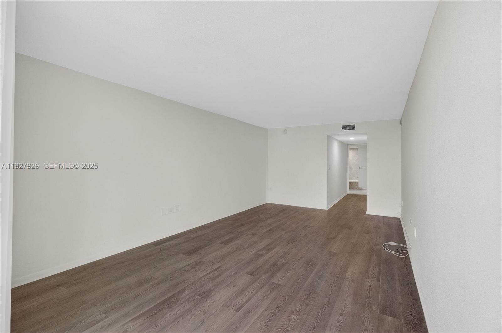 600 Grapetree Drive, Unit 8FS Key Biscayne, FL 33149 - Photo 28 of 54 a view of an empty room and wooden floor