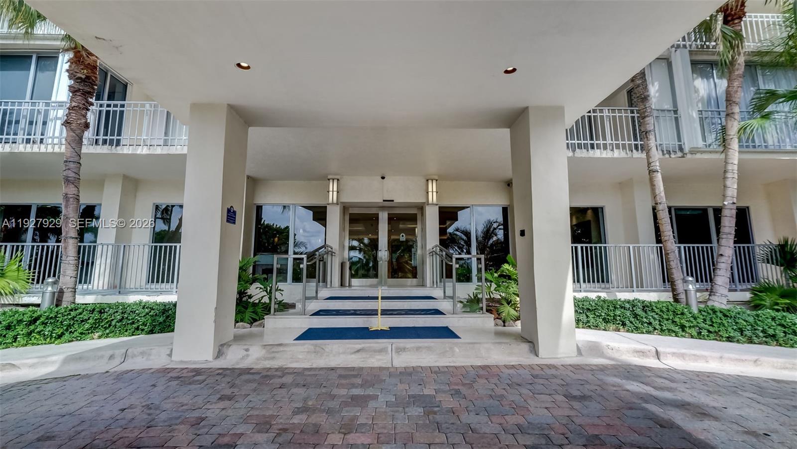 600 Grapetree Drive, Unit 8FS Key Biscayne, FL 33149 - Photo 3 of 54 a front view of a building with street view
