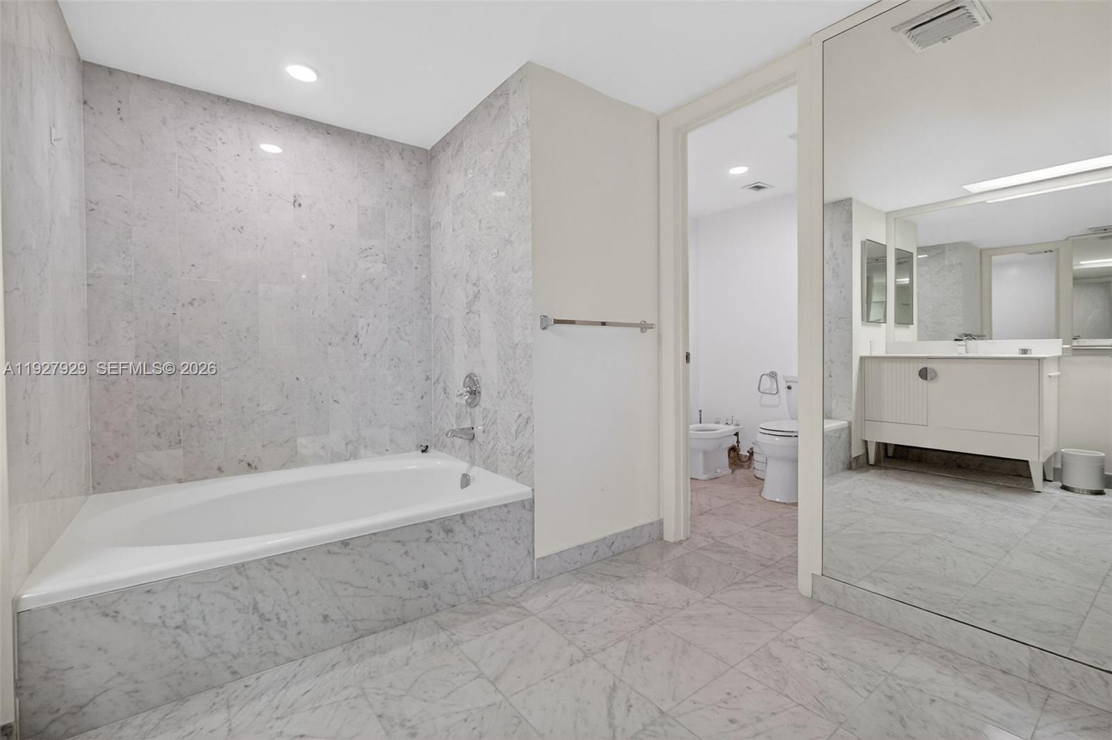 600 Grapetree Drive, Unit 8FS Key Biscayne, FL 33149 - Photo 31 of 54 a spacious bathroom with a bathtub and a shower
