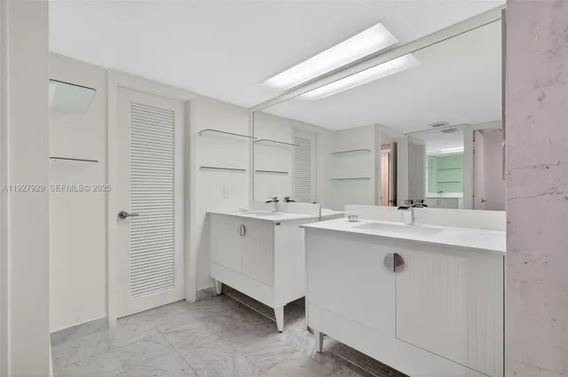 a bathroom with a shower a toilet and a sink