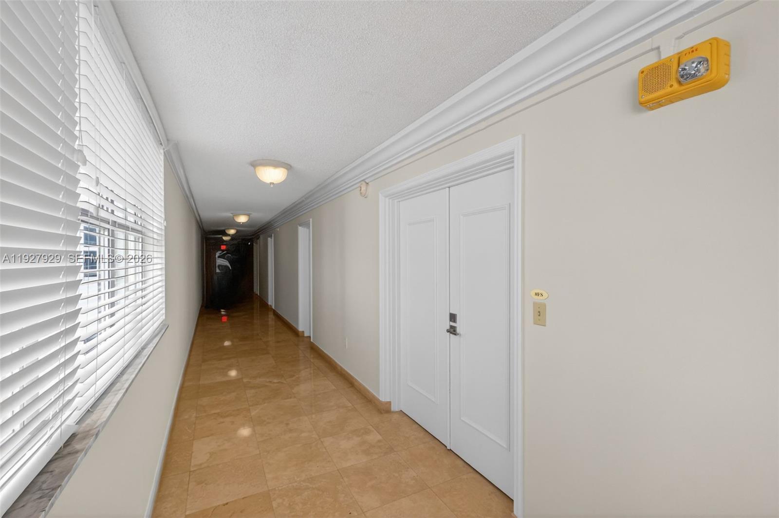 600 Grapetree Drive, Unit 8FS Key Biscayne, FL 33149 - Photo 41 of 54 a view of a hallway with wooden floor and staircase