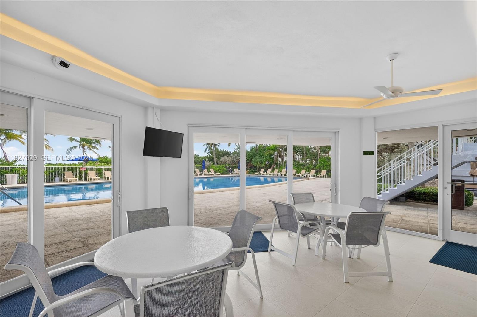 600 Grapetree Drive, Unit 8FS Key Biscayne, FL 33149 - Photo 45 of 54 a view of a dining room with furniture window and wooden floor