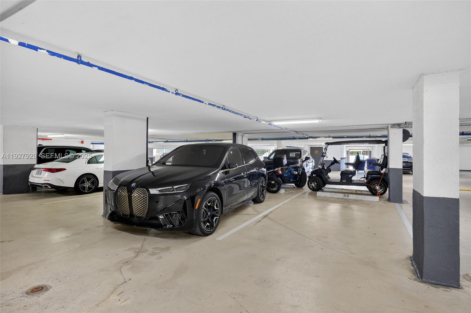600 Grapetree Drive, Unit 8FS Key Biscayne, FL 33149 - Photo 46 of 54 a view of parking garage with cars parked