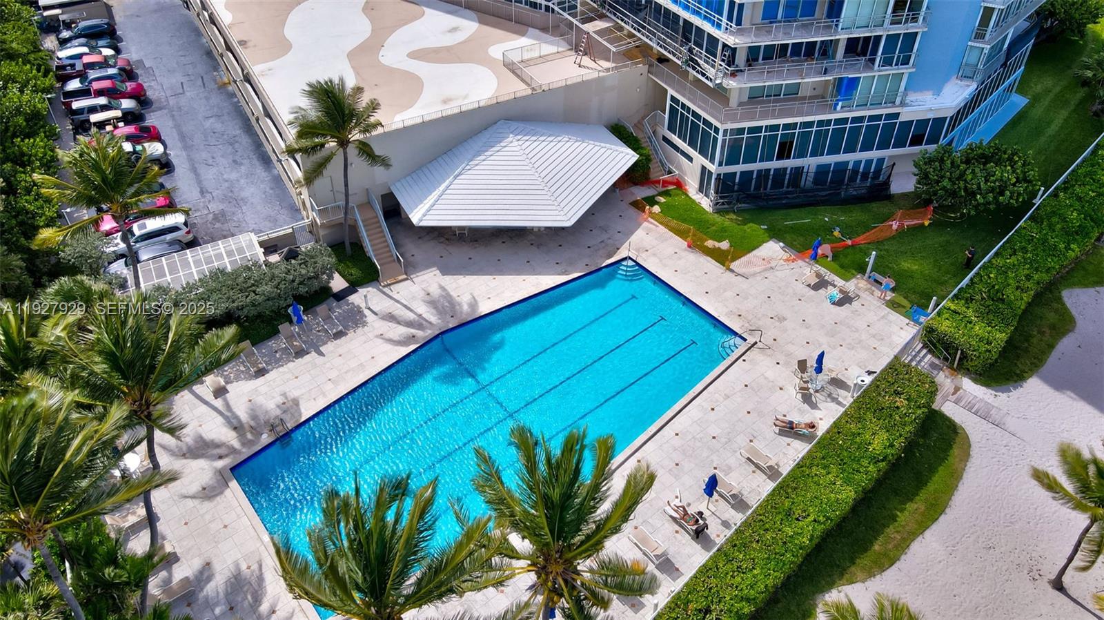 600 Grapetree Drive, Unit 8FS Key Biscayne, FL 33149 - Photo 53 of 54 a view of swimming pool with outdoor seating and plants