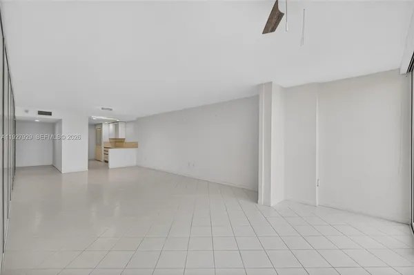 a view of an empty room with a sliding door