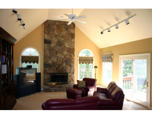 576 Dutton Road Sudbury, MA 01776 - Photo 5 of 22 a living room with furniture and a fireplace