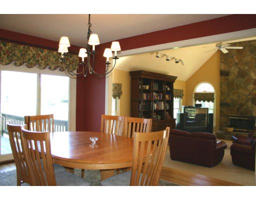 576 Dutton Road Sudbury, MA 01776 - Photo 8 of 22 a view of a dining room with furniture and chandelier