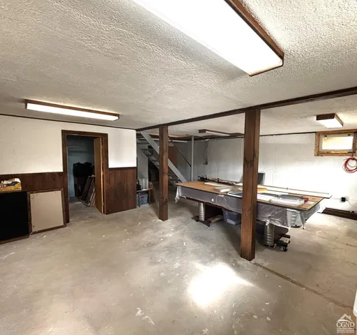 a view of a swimming pool with a yard