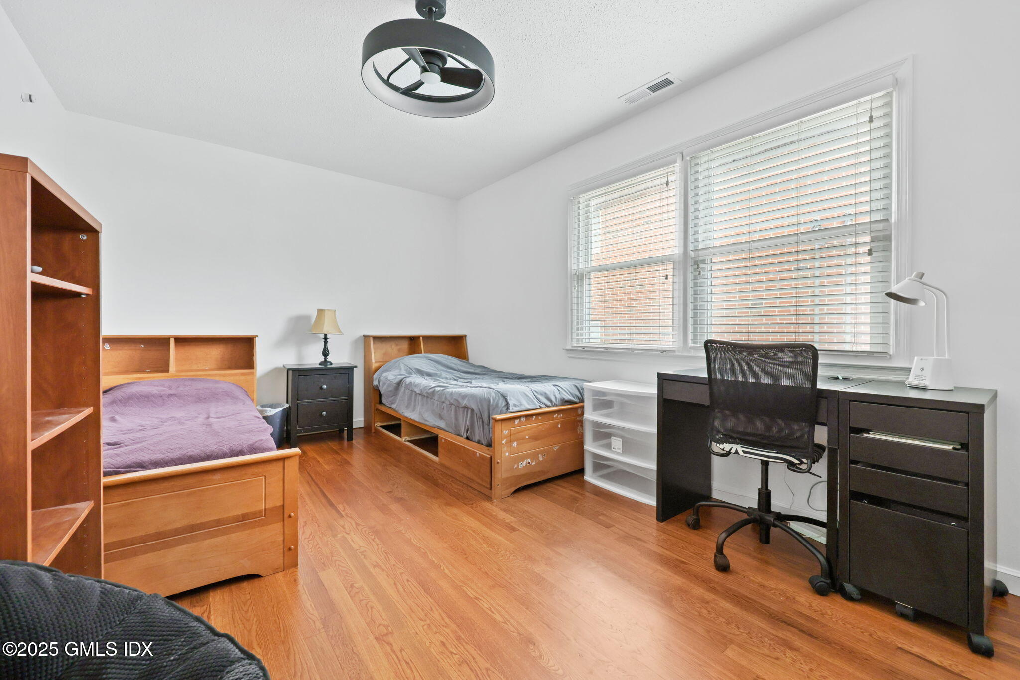 14 Harold Avenue, Unit 4 Greenwich, CT 06830 - Photo 12 of 23 a bedroom with bed and a window