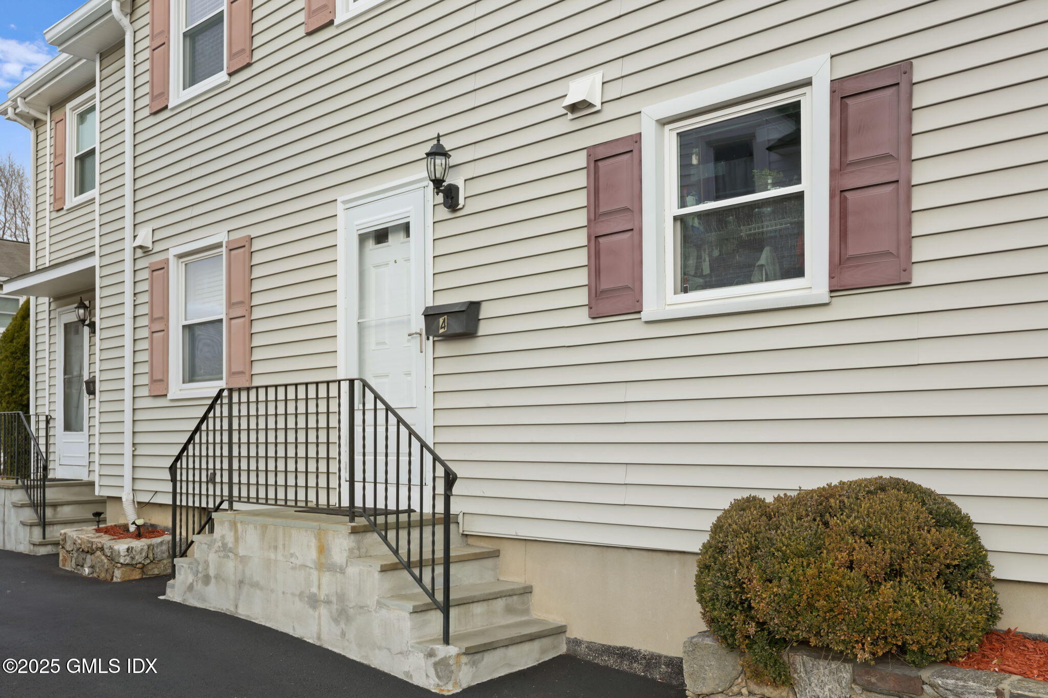 14 Harold Avenue, Unit 4 Greenwich, CT 06830 - Photo 2 of 23 a view of a porch with a door and a large window