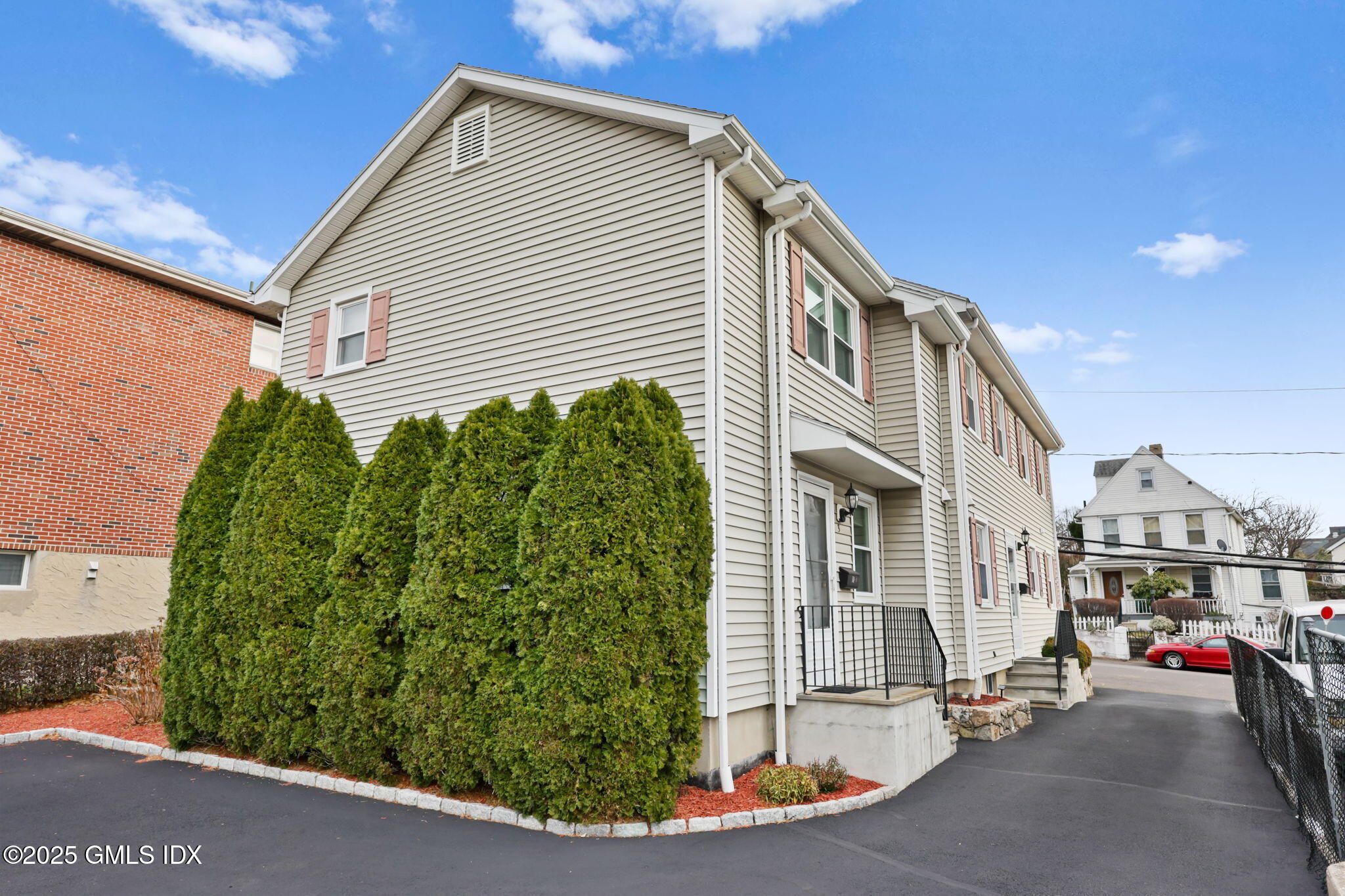 14 Harold Avenue, Unit 4 Greenwich, CT 06830 - Photo 21 of 23 a view of a house with a street