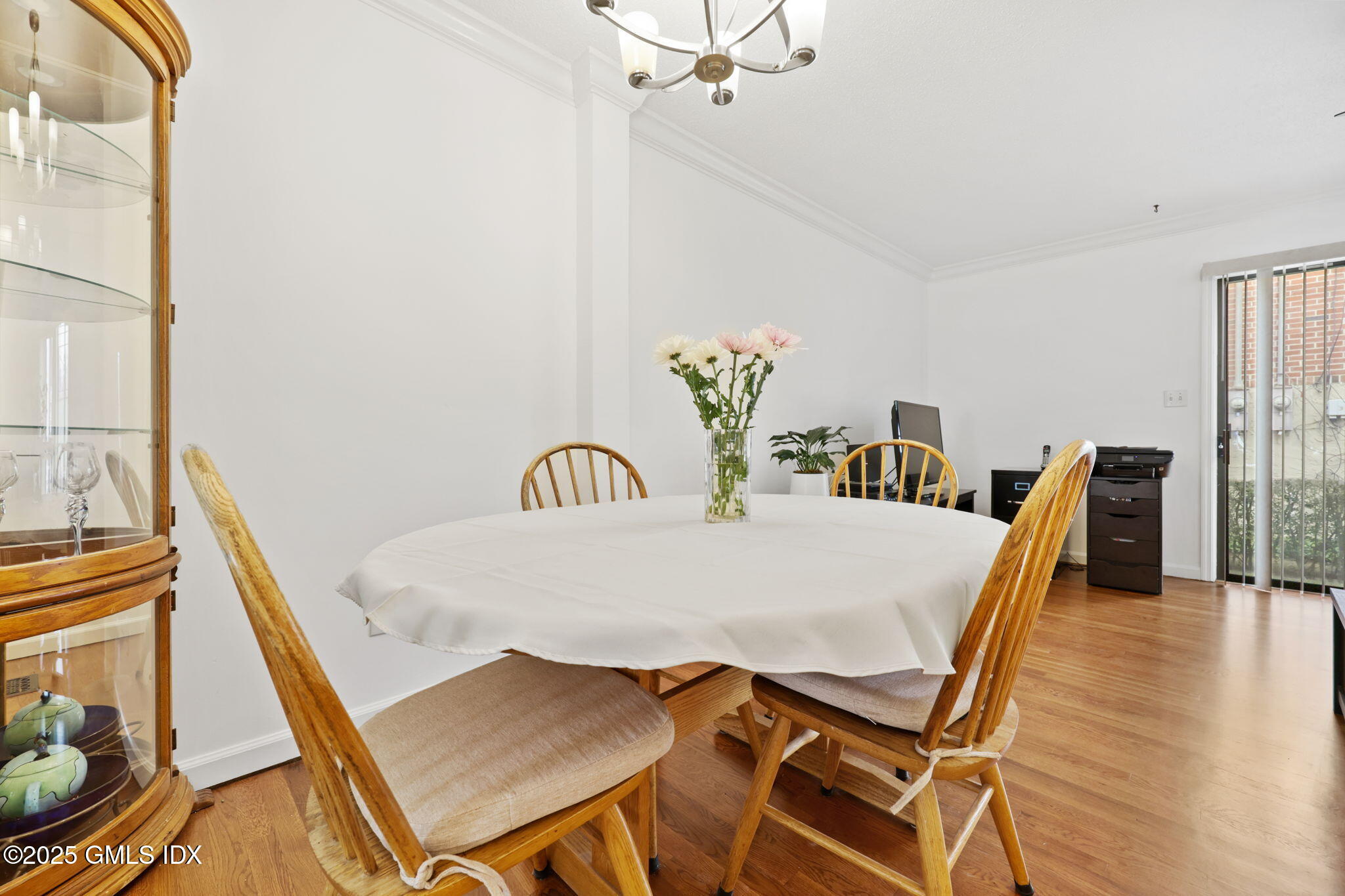 14 Harold Avenue, Unit 4 Greenwich, CT 06830 - Photo 7 of 23 a dining room with furniture and wooden floor