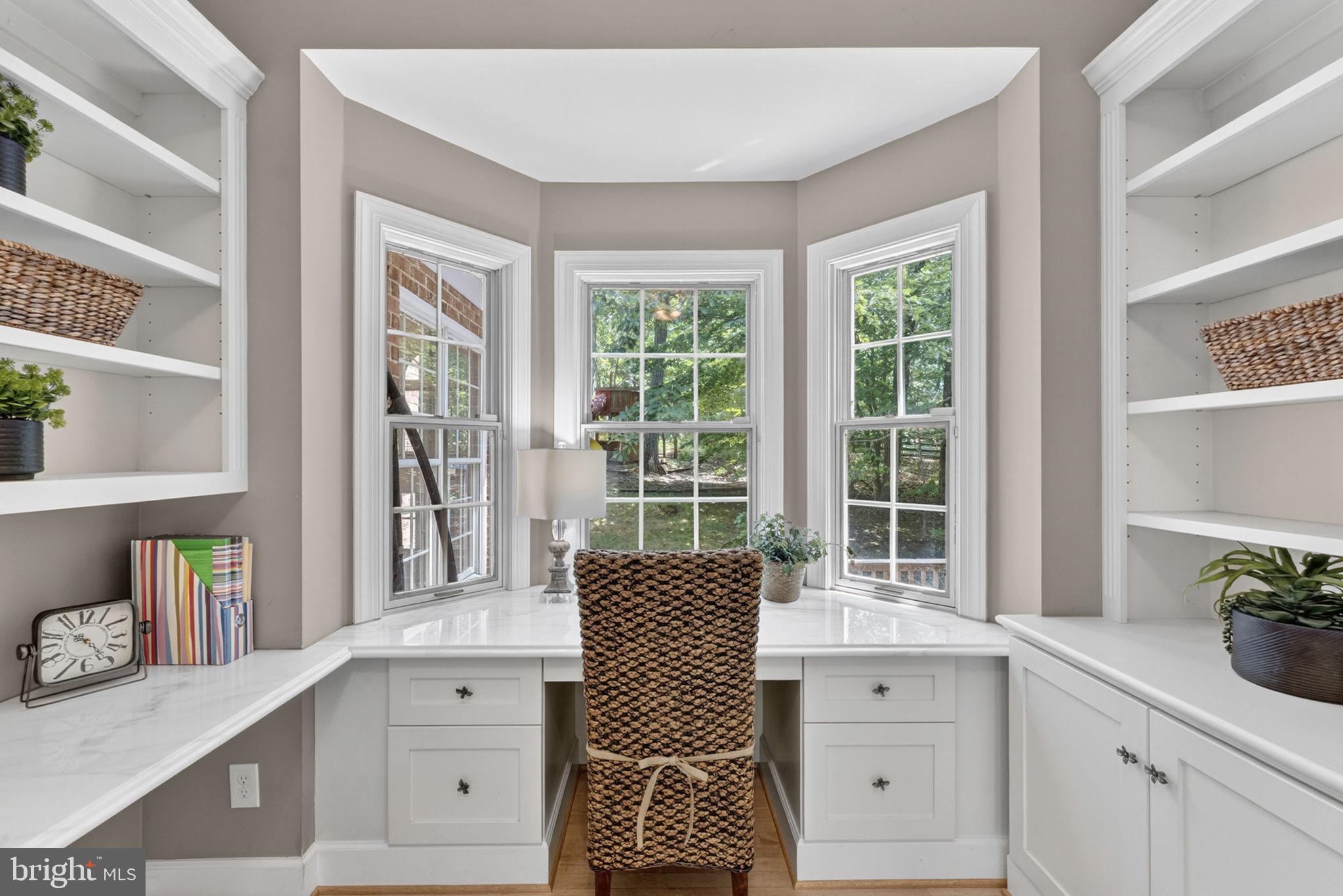 4531 Den Haag Road Warrenton, VA 20187 - Photo 40 of 103 a dining room with a window and a potted plant on the dresser