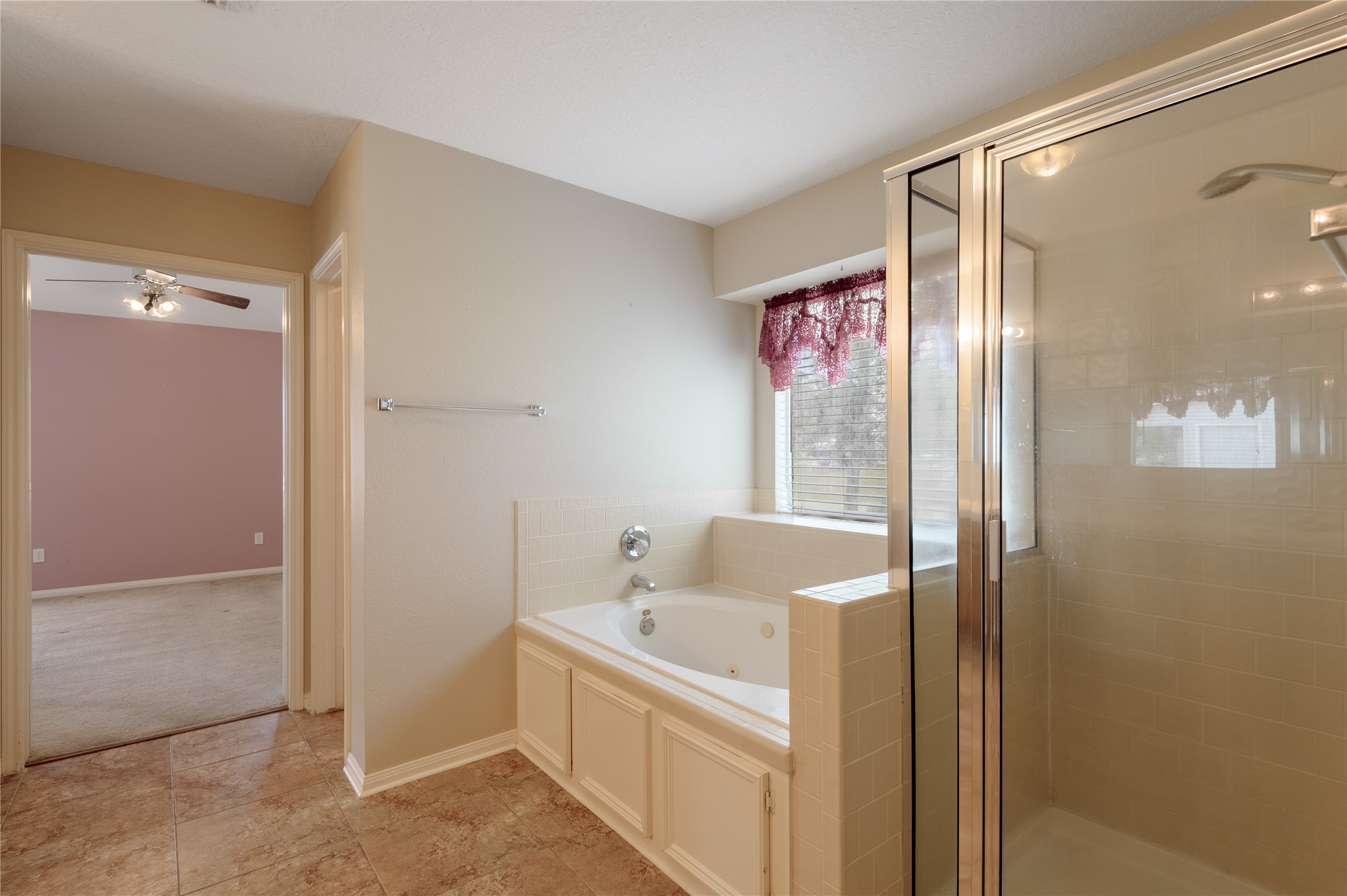 324 Red Oak Lane Trinity, TX 75862 - Photo 28 of 49 a bathroom with a bathtub and a shower