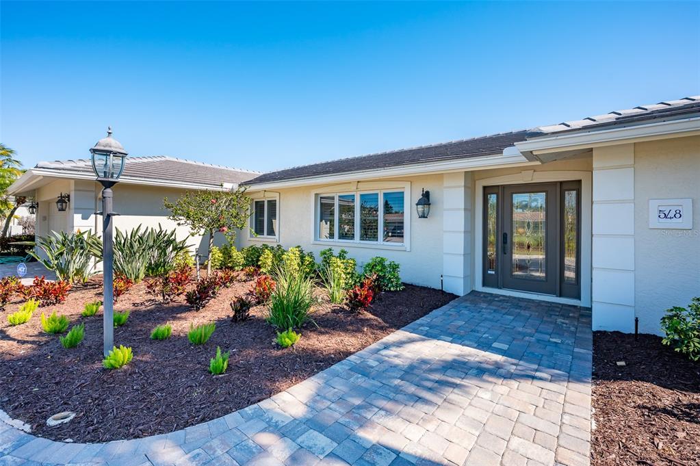 548 Gunwale Lane Longboat Key, FL 34228 - Photo 14 of 62 a view of a potted plants in front of a house
