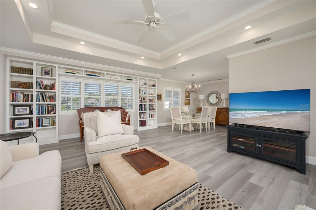548 Gunwale Lane Longboat Key, FL 34228 - Photo 20 of 62 a living room with furniture and a bookshelf