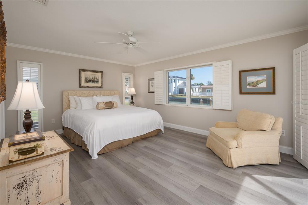 548 Gunwale Lane Longboat Key, FL 34228 - Photo 25 of 62 a bedroom with a bed and a couch