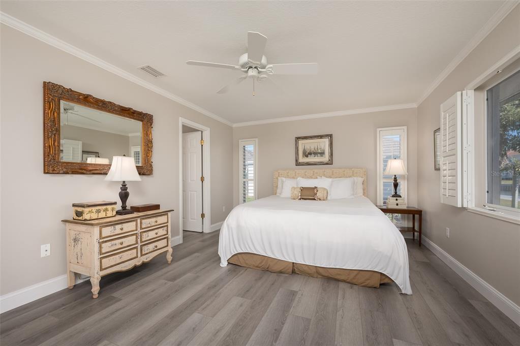 548 Gunwale Lane Longboat Key, FL 34228 - Photo 27 of 62 a bedroom with a bed and a dresser