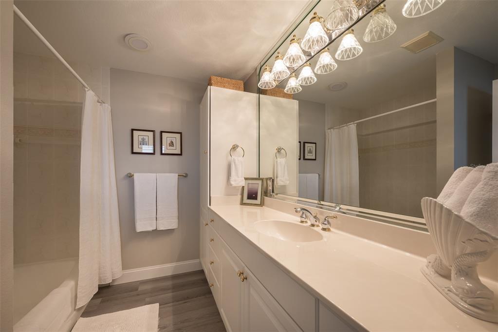548 Gunwale Lane Longboat Key, FL 34228 - Photo 35 of 62 a bathroom with a double vanity sink and a mirror