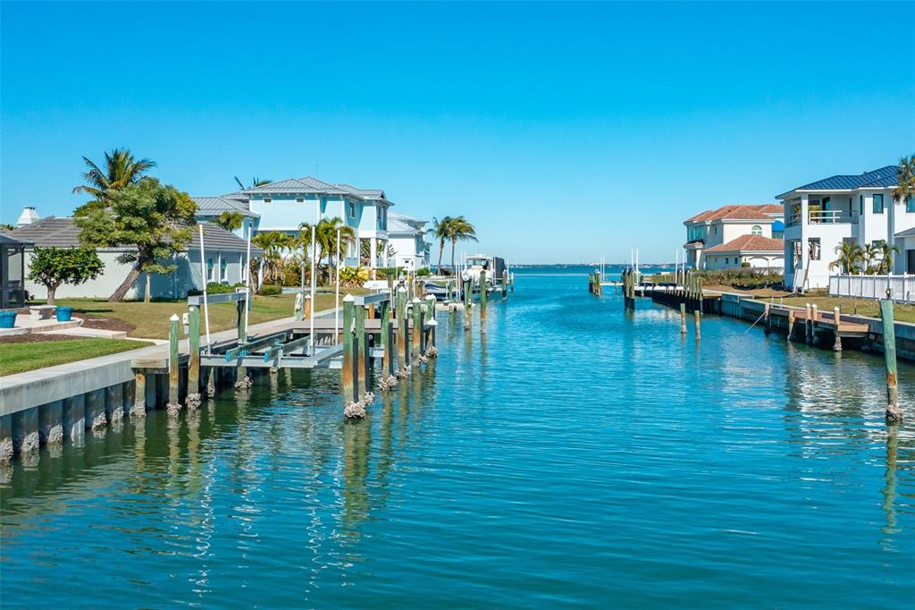 548 Gunwale Lane Longboat Key, FL 34228 - Photo 4 of 62 a view of a swimming pool with outdoor seating