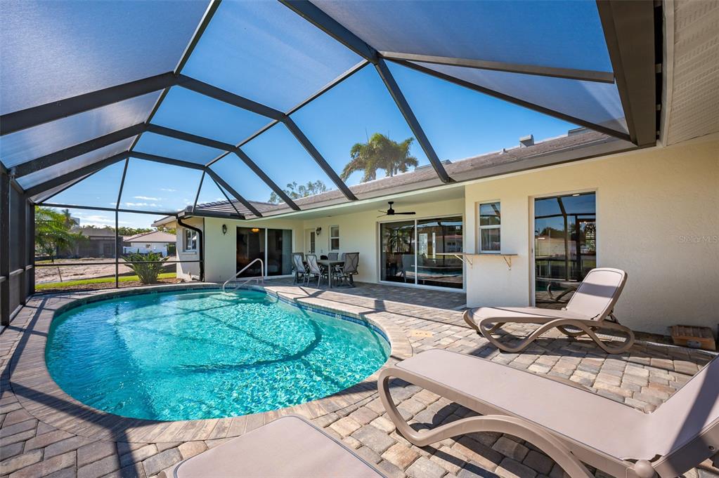 548 Gunwale Lane Longboat Key, FL 34228 - Photo 43 of 62 a view of a swimming pool with a patio