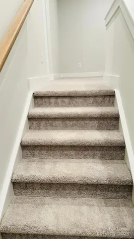 a bathroom with a glass door shower