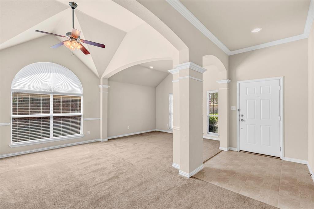 5316 Ridgeson Drive McKinney, TX 75071 - Photo 12 of 33 Spacious interior featuring vaulted ceilings and a ceiling fan with light fixture