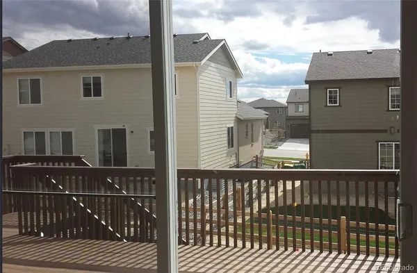 a view of a brick building from a balcony