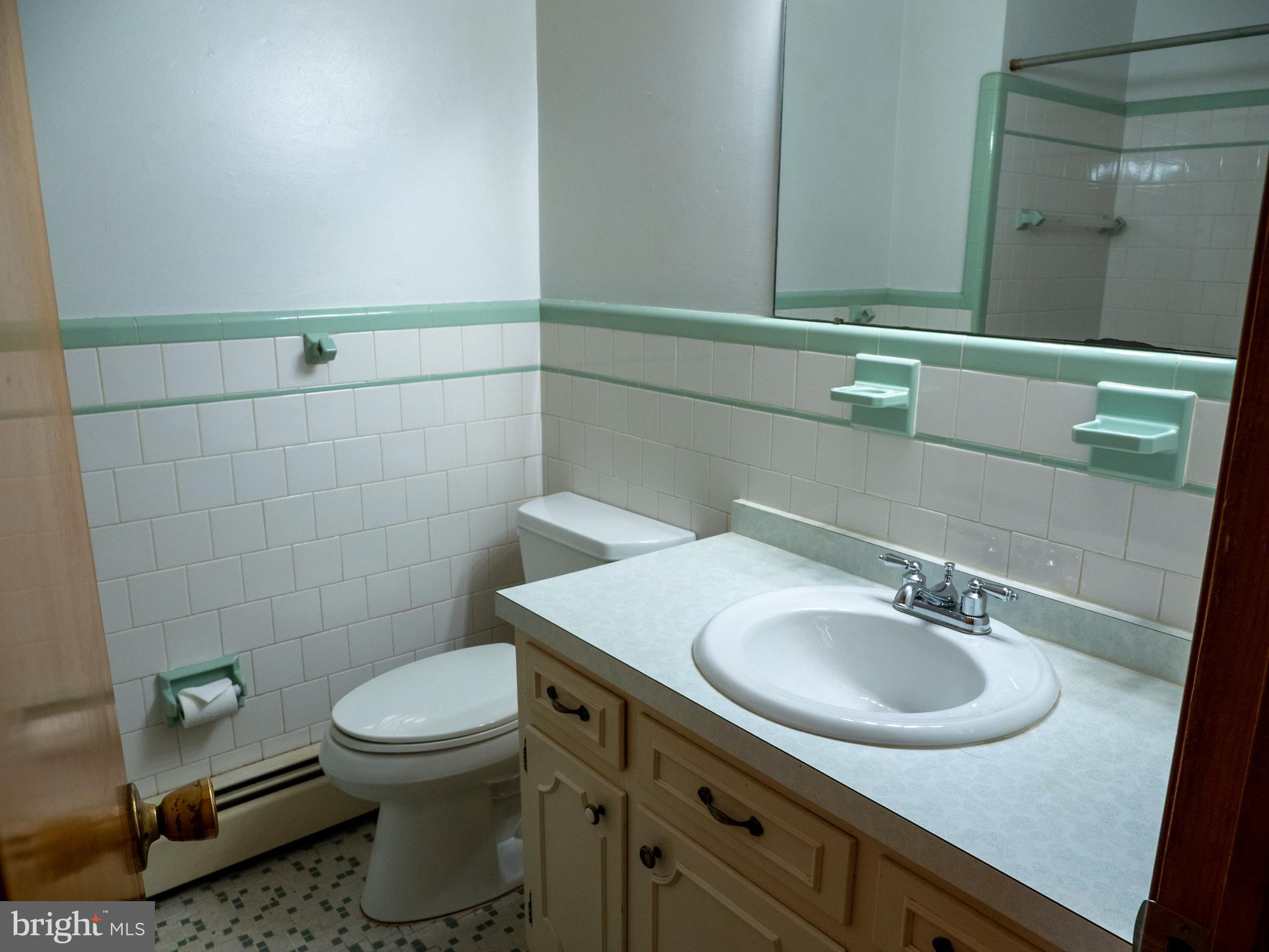 26906 Clarksburg Road Damascus, MD 20872 - Photo 9 of 17 a bathroom with a sink toilet and mirror