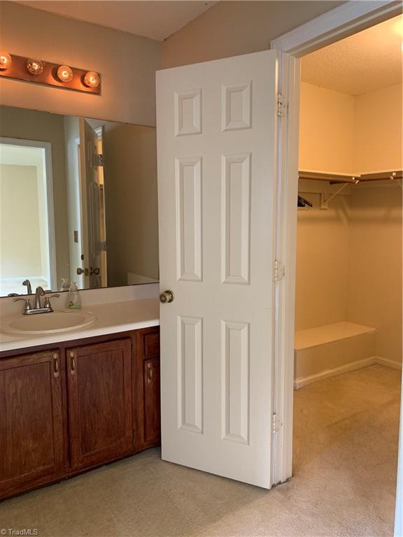 4402 Garden Club Street High Point, NC 27265 - Photo 11 of 23 Master Bath Vanity looking into Walk-in Closet
