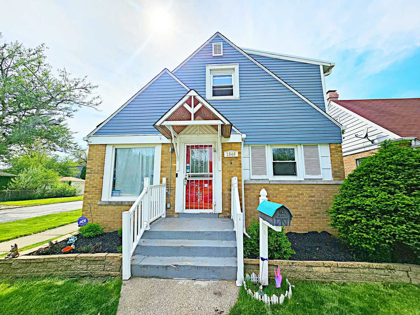 1546 State Line Road Calumet City, IL 60409 - Photo 1 of 16 a front view of a house with a yard table and chairs