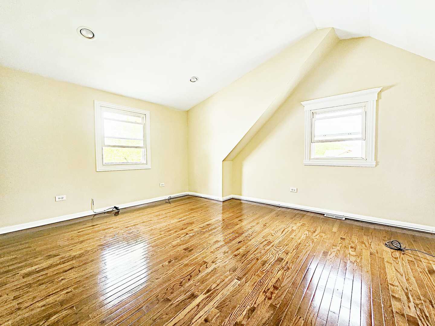 1546 State Line Road Calumet City, IL 60409 - Photo 8 of 16 a view of an empty room with wooden floor and a window