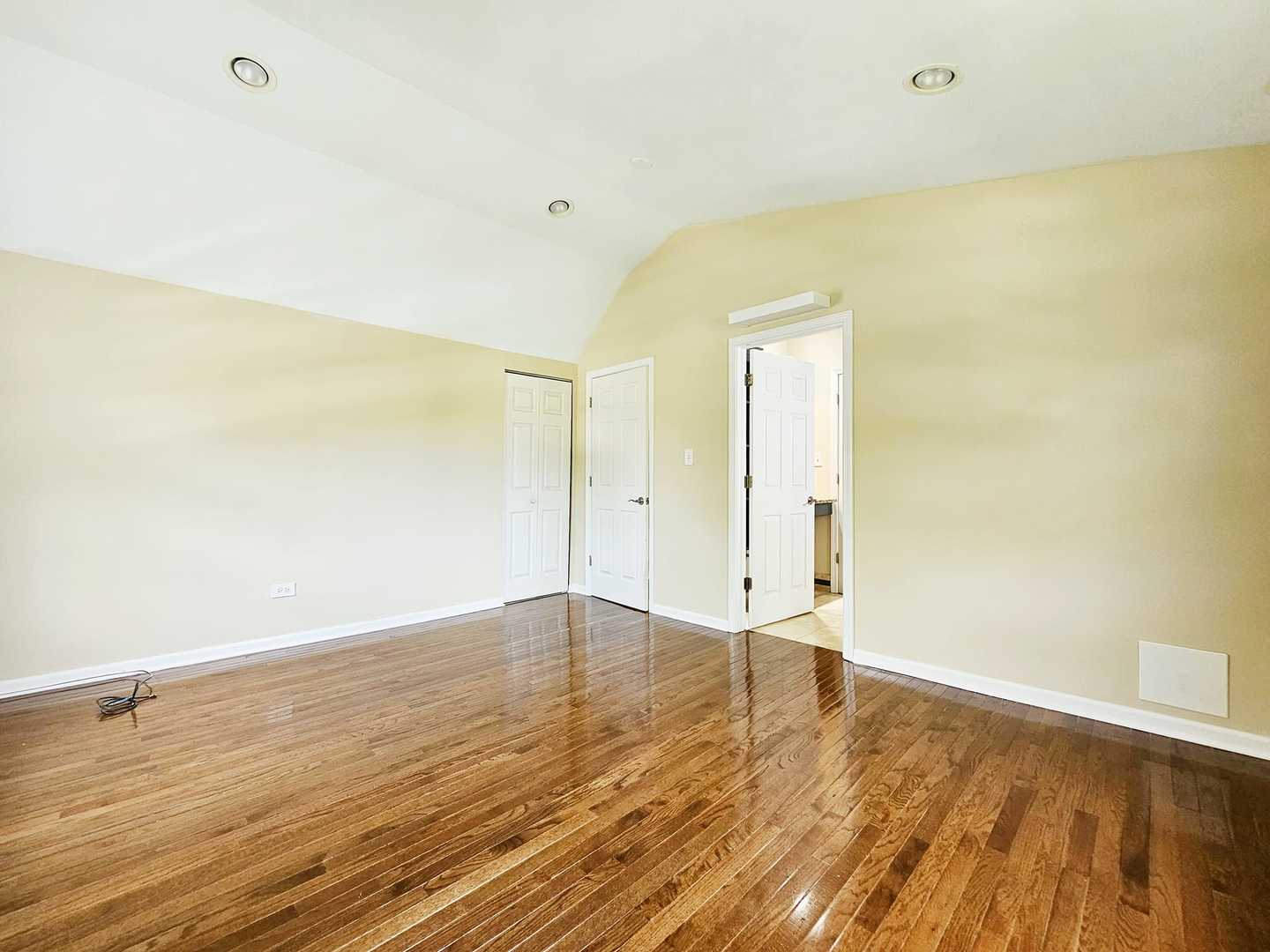 1546 State Line Road Calumet City, IL 60409 - Photo 9 of 16 a view of an empty room with wooden floor and a window