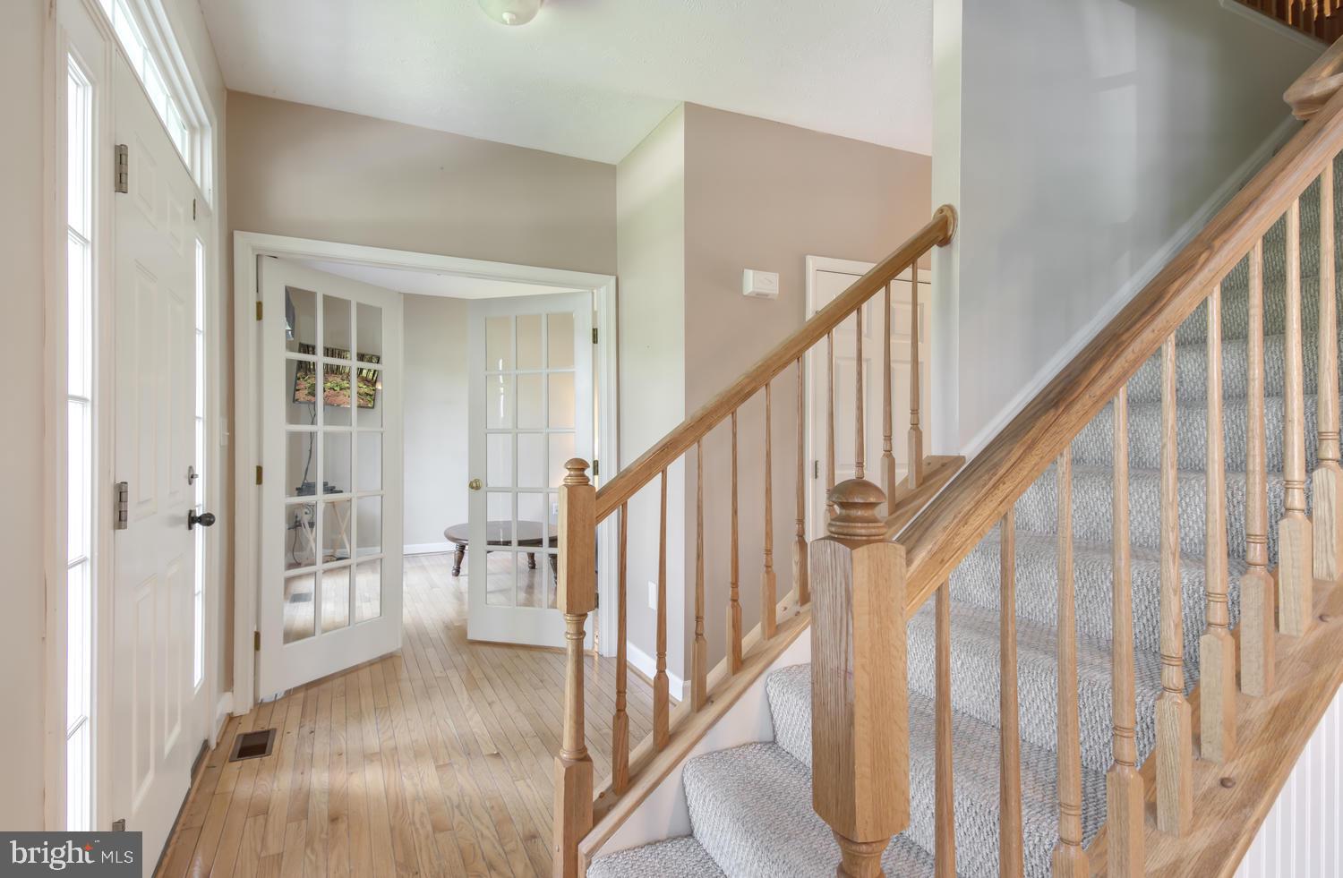 Foyer with gleaming wood floors.
