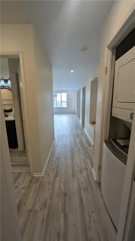 a view of a kitchen from a hallway