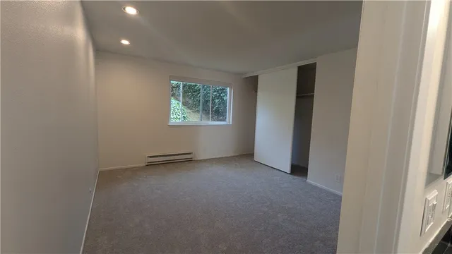 a view of an empty room with a window