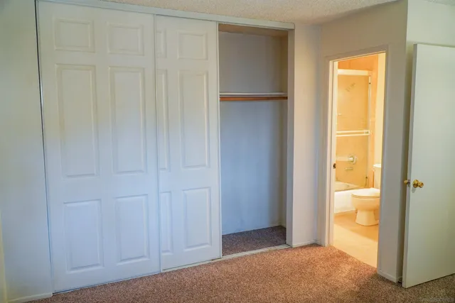 a kitchen with granite countertop a sink stove and cabinets